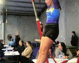 Aiva competing on bar at the 2024 WMGC Competition 