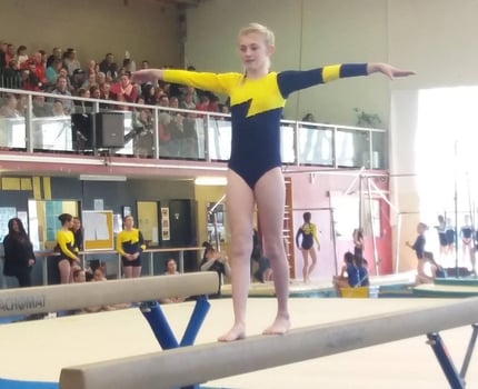 Tamzin competing in Beam at the 2018 CSG Competition